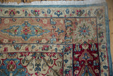 Distressed Kerman carpet corner with low pile, fuchsia, sky blue, ivory floral lattice pattern.