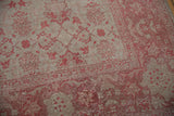 Distressed Oushak carpet pile texture, pale raspberry pink florals on platinum.