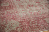 Distressed Oushak carpet pile, faded floral medallions, raspberry and platinum tones.