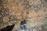 Intricate scrolling vinery and palmettes on vintage Meshed carpet with outer stripe border.