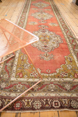 Vintage Anatolian runner's scalloped medallion and serrated vine border in blush, sage, ivory.