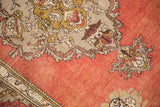 Vintage Anatolian runner: blush, gold, aubergine scalloped contour medallion detail.