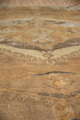 Detail of worn pile and exposed foundation on the distressed Oushak carpet.