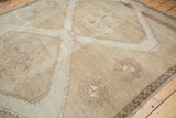 Vintage Distressed Oushak rug with tone-on-tone beige and sand abrashes and primitive motifs.