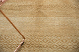 Even wear across knot heads on the vintage distressed Oushak rug's beige lattice pattern.