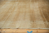 Distressed vintage Oushak rug with subtle lattice design, soft abrashes, and visible original selvage.