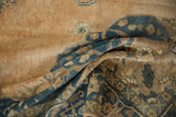 Distressed Sivas carpet with textural pile, highlighting faded dusty teal and apricot patterns.