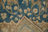 Distressed Sivas carpet: even wear on blue and coffee brown pile, revealing woven foundation and secured edge.