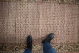 Vintage Oushak runner with an allover distressed raspberry lattice and ivory field.