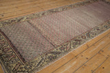 Distressed vintage Oushak runner with raspberry lattice field, worn texture, and cypress tree border.