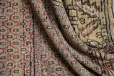 Distressed Oushak runner pile reveals worn geometric motifs in raspberry, brown, beige, and gray.