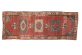 Vintage distressed Oushak rug runner, triple medallions on cherry red with charcoal and ivory abrashes.