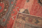 Secured side finish, hand-knotted back, and distressed pile of vintage Oushak rug.