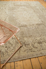 Distressed pile texture of Rococo-inspired beige and brown ornamental pattern.