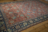 Safavid inspired blue, ivory, brick red palmette field with intricate navy border.