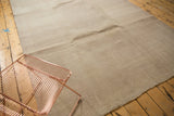 Distressed vintage Oushak carpet with neutral sand, beige, and antique ivory texture.
