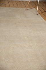 Hand-knotted distressed Oushak rug's neutral texture and even pile wear.