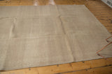 Expansive distressed texture and neutral sand, beige, antique ivory tones of the Oushak rug.