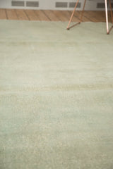 Pale seafoam green distressed Oushak rug with visible foundation texture.