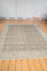 Distressed vintage Sparta border with intricate floral blossoms in antique ivory and muted tones.