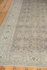 Decorative floral patterns with a time-softened, distressed texture on a vintage Sparta rug.