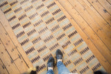 Textured distressed Modern Oushak runner with finned geometric shapes in seafoam, saffron, and brown.