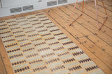 Distressed Modern Oushak runner pattern with rhythmic sea foam, saffron, and brown geometric shapes.