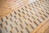 Distressed Modern Oushak runner, finned geometric pattern in sea foam, saffron, and brown.