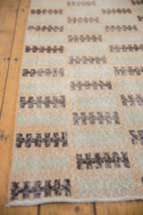 Distressed Modern Oushak runner, with chocolate finned geometric pattern and visible foundation.