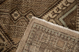 Visible hand-knotted pile and foundation of vintage Serab rug with chocolate brown and ivory geometric designs.
