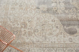 Detail of distressed vintage Sparta carpet, showing even wear and soft ivory, beige, grey tones.