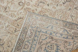 Corner of vintage distressed Sparta carpet showing worn pile and distinct hand-knotted reverse.