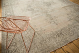 Distressed Sivas carpet displaying an aged ivory field and faded charcoal floral border.