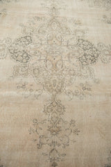 Distressed Turkish Sivas carpet with faded ivory and muted gray curvilinear floral design.