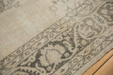 Distressed vintage Sivas rug: ornamental border with muted charcoal and ivory tones.