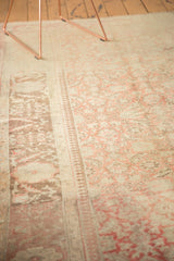 Distressed vintage Anatolian rug surface with abrashed pale raspberry and coffee brown tones.