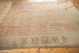 Distressed Anatolian carpet with pale bronze and coffee brown border showing abrashed texture.