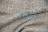 Folded distressed vintage Kashan rug, subtle apricot and pale blue tones, light foundation wear.