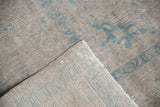 Distressed vintage Kashan carpet pile showing worn knot heads and exposed woven foundation.