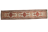 Vintage Serab runner with triple red medallions and geometric vinery on pale sand.