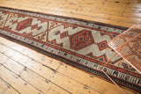 Geometric vinery ground and ornate medallion on a vintage Serab runner in sand and tomato red.