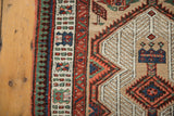 Vintage Serab runner border in red, green, blue, and pale sand field finial.