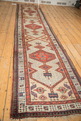 Fringe and geometric end finial motifs on a hand-knotted vintage Serab runner.