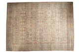 Distressed Persian Mahal carpet, ivory field with Farahan Sarouk style arabesques in terra cotta and blue.
