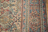 Distressed vintage Mahal carpet: Farahan Sarouk style arabesques in ivory, terra cotta, blue.