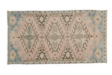 Decorative distressed vintage Oushak rug with triple geometric medallions in dusty rose, sky blue, and brown, 1'9