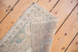 Hand-knotted reverse and distressed pale blue, ivory pile of the vintage Oushak rug.