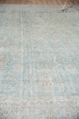 Distressed pale ocean green and antique ivory field texture on this vintage Sivas carpet.