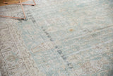 Distressed vintage Sivas rug surface with pale ocean green, antique ivory, and visible wear.