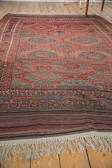 Antique Belouch carpet: original plainwoven kilim end, striped patterns, antique ivory fringe.